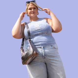 girl wearing a tank top and jeans